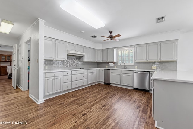 8001 Alpha Rd, Abbeville, LA 70510 - kitchen featuring dishwasher, ornamental molding, dark wood-style flooring, a ceiling fan, and decorative backsplash