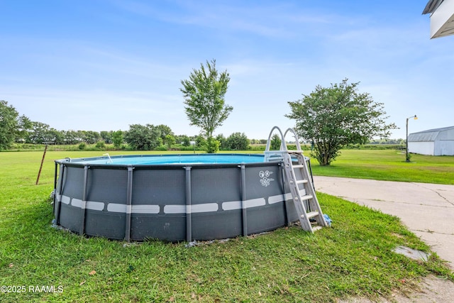 8001 Alpha Rd, Abbeville, LA 70510 - swimming pool featuring a lawn