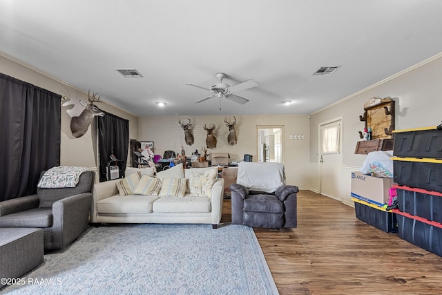 8001 Alpha Rd, Abbeville, LA 70510 - living area featuring crown molding, wood finished floors, and ceiling fan