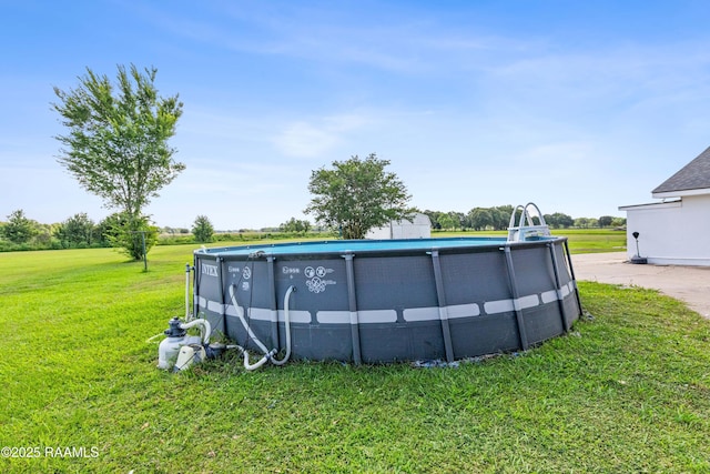 8001 Alpha Rd, Abbeville, LA 70510 - swimming pool featuring a yard