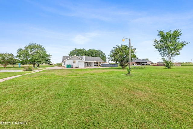 8001 Alpha Rd, Abbeville, LA 70510 - view of front of house with a front lawn and concrete driveway