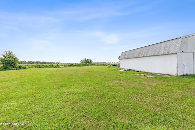 8001 Alpha Rd, Abbeville, LA 70510 - view of green lawn with an outbuilding, an outdoor structure, and a rural view
