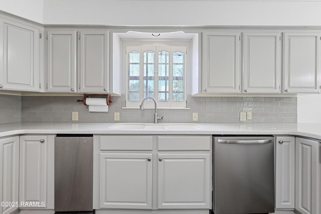 8001 Alpha Rd, Abbeville, LA 70510 - kitchen featuring dishwasher, a sink, light countertops, and tasteful backsplash