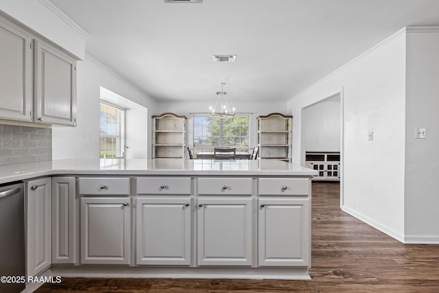 8001 Alpha Rd, Abbeville, LA 70510 - kitchen featuring stainless steel dishwasher, gray cabinets, a chandelier, dark wood-type flooring, and light countertops