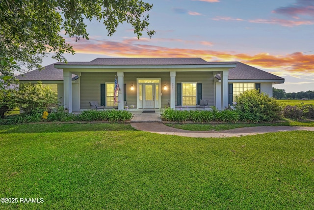 8001 Alpha Rd, Abbeville, LA 70510 - single story home with a porch, a front lawn, and a shingled roof