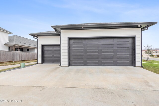201 Lake Crest Ln, Youngsville, LA 70592 - garage featuring concrete driveway