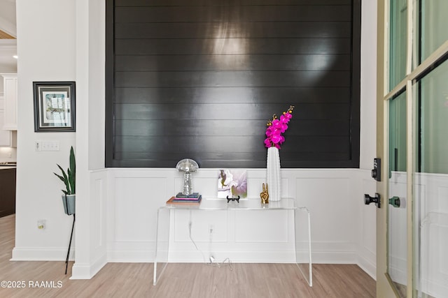 201 Lake Crest Ln, Youngsville, LA 70592 - detailed view of wood finished floors, a decorative wall, and a wainscoted wall