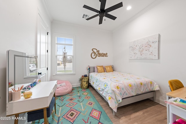 201 Lake Crest Ln, Youngsville, LA 70592 - bedroom featuring wood finished floors, crown molding, baseboards, a ceiling fan, and recessed lighting
