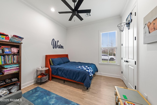 201 Lake Crest Ln, Youngsville, LA 70592 - bedroom with wood finished floors, baseboards, ornamental molding, recessed lighting, and ceiling fan