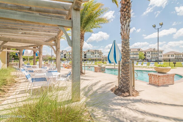 201 Lake Crest Ln, Youngsville, LA 70592 - community pool featuring a patio area and a residential view