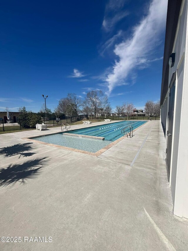 201 Lake Crest Ln, Youngsville, LA 70592 - community pool with a patio area