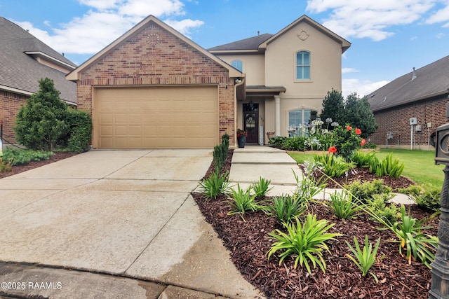 107 Ace Ln, Lafayette, LA 70506 - traditional home featuring an attached garage, concrete driveway, brick siding, and stucco siding