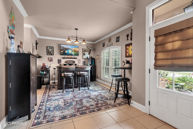 107 Ace Ln, Lafayette, LA 70506 - dining room with a dry bar, healthy amount of natural light, crown molding, and tile patterned flooring