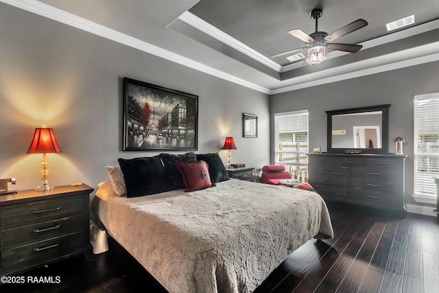 107 Ace Ln, Lafayette, LA 70506 - bedroom featuring a raised ceiling, dark wood-style flooring, ornamental molding, and a ceiling fan