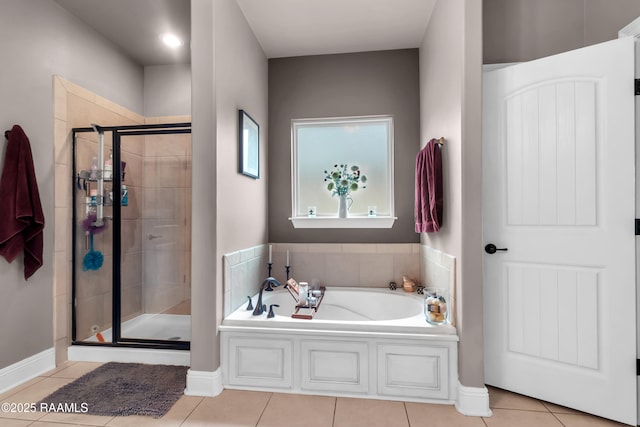 107 Ace Ln, Lafayette, LA 70506 - bathroom with a bath, a stall shower, and tile patterned flooring