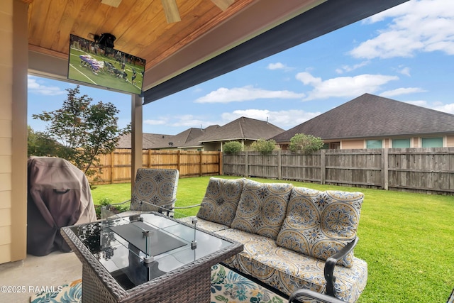 107 Ace Ln, Lafayette, LA 70506 - fenced backyard featuring an outdoor living space, area for grilling, and a ceiling fan