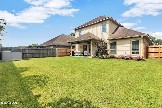 107 Ace Ln, Lafayette, LA 70506 - back of property with a fenced backyard, a patio area, and a shingled roof