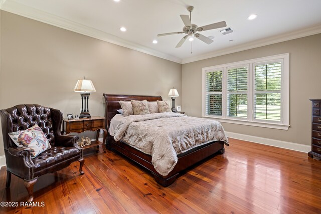 2822 Teal Dr, New Iberia, LA 70560 - bedroom with wood finished floors, crown molding, recessed lighting, and ceiling fan