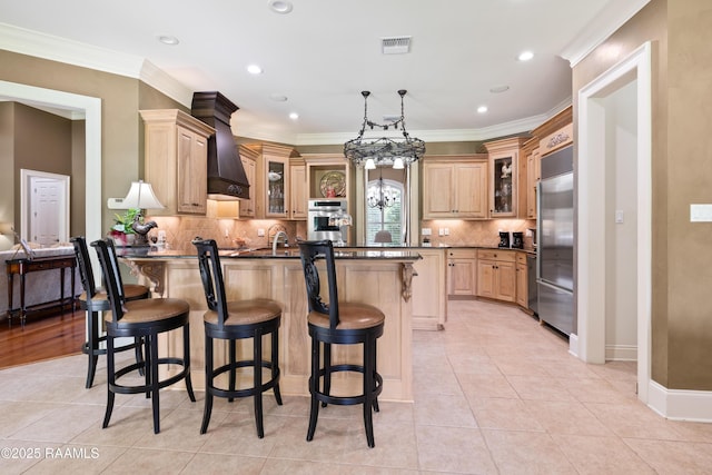 2822 Teal Dr, New Iberia, LA 70560 - kitchen featuring stainless steel appliances, dark countertops, a kitchen bar, decorative backsplash, and recessed lighting