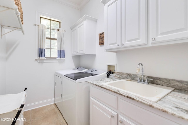 144 Cypress Cv, Youngsville, LA 70592 - laundry room with cabinet space, washing machine and dryer, ornamental molding, baseboards, and light tile patterned floors