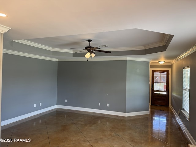 105 Ridge Run Ln, Carencro, LA 70520 - unfurnished room featuring a raised ceiling, crown molding, dark tile patterned floors, a ceiling fan, and baseboards