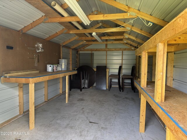 105 Ridge Run Ln, Carencro, LA 70520 - misc room with concrete floors, lofted ceiling, and a garage