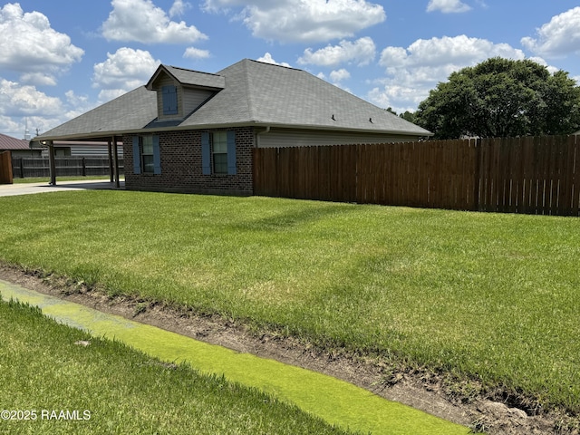 105 Ridge Run Ln, Carencro, LA 70520 - view of home's exterior featuring brick siding, a carport, a shingled roof, and concrete driveway