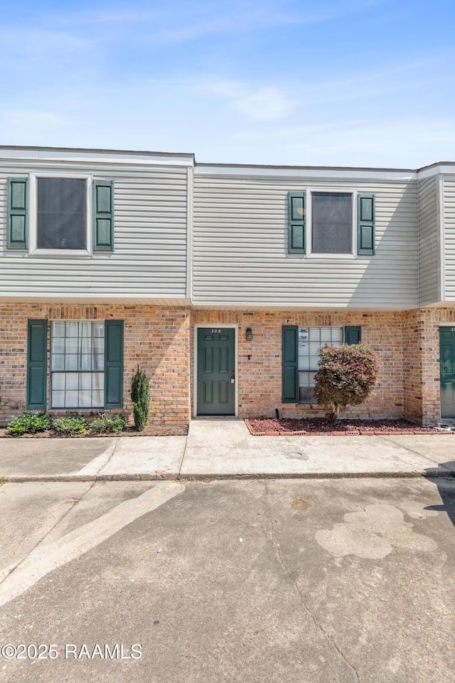 100 Winchester Dr Unit 308, Lafayette, LA 70506 - view of property with brick siding