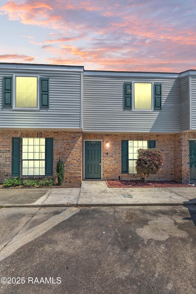 100 Winchester Dr Unit 308, Lafayette, LA 70506 - view of property featuring brick siding