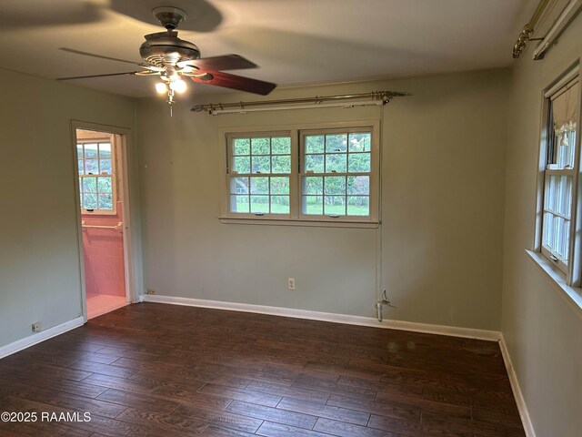 500 Brentwood Blvd, Lafayette, LA 70503 - unfurnished room with dark wood finished floors, a ceiling fan, and baseboards
