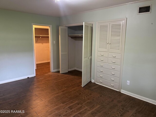 500 Brentwood Blvd, Lafayette, LA 70503 - unfurnished bedroom with dark wood finished floors and baseboards