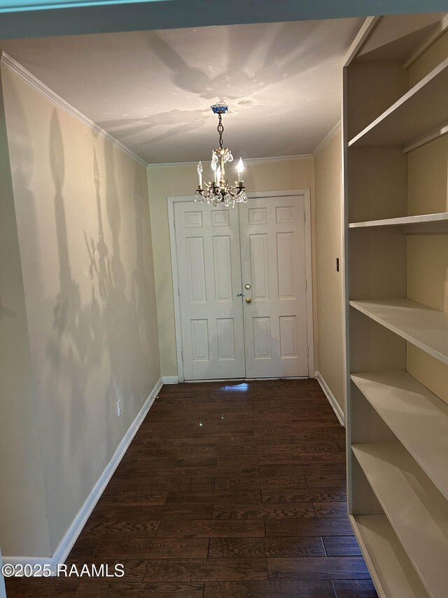 500 Brentwood Blvd, Lafayette, LA 70503 - unfurnished dining area with a chandelier, ornamental molding, dark wood-type flooring, and baseboards