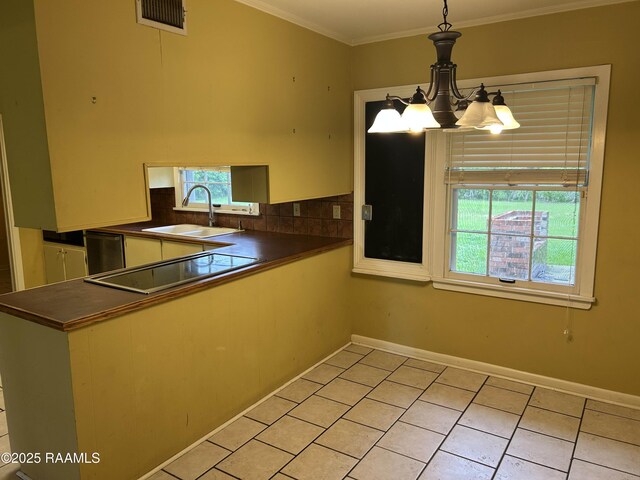 500 Brentwood Blvd, Lafayette, LA 70503 - kitchen with a sink, dark countertops, black electric stovetop, dishwasher, and crown molding