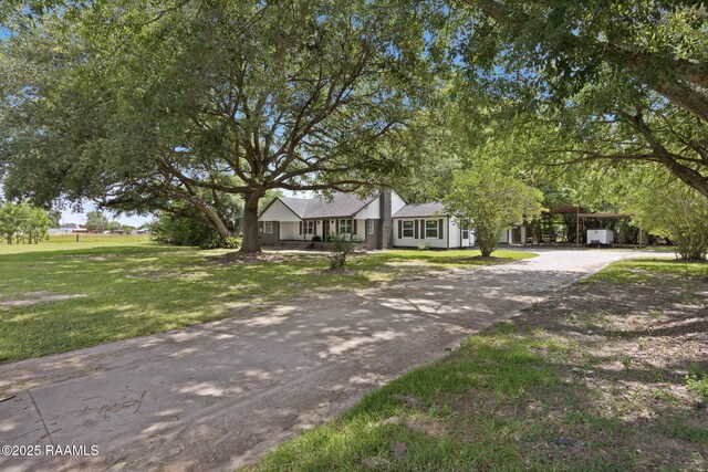 178 Bertrand Rd, Opelousas, LA 70570 - view of front of home with a front lawn and asphalt driveway