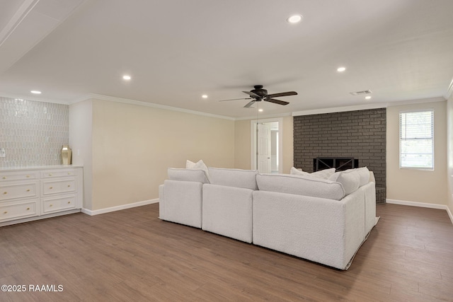 178 Bertrand Rd, Opelousas, LA 70570 - living area featuring crown molding, recessed lighting, wood finished floors, baseboards, and a ceiling fan