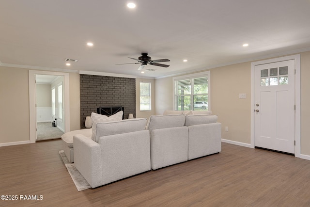 178 Bertrand Rd, Opelousas, LA 70570 - living area with crown molding, a ceiling fan, wood finished floors, recessed lighting, and baseboards