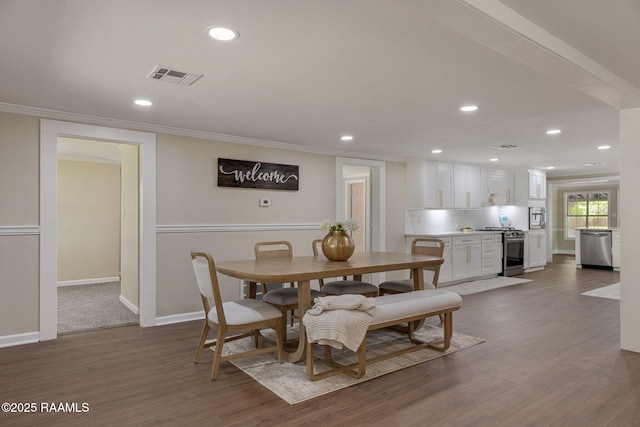 178 Bertrand Rd, Opelousas, LA 70570 - dining space with crown molding, recessed lighting, dark wood finished floors, and baseboards