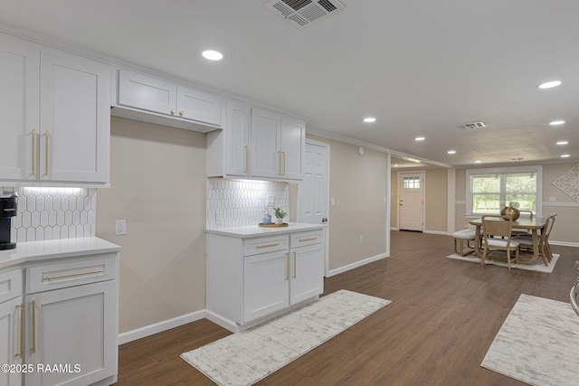 178 Bertrand Rd, Opelousas, LA 70570 - kitchen with recessed lighting, white cabinets, tasteful backsplash, and baseboards