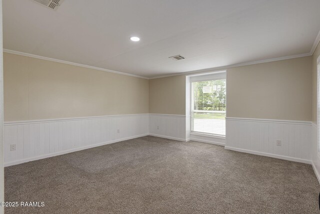178 Bertrand Rd, Opelousas, LA 70570 - spare room featuring carpet flooring, wainscoting, and crown molding