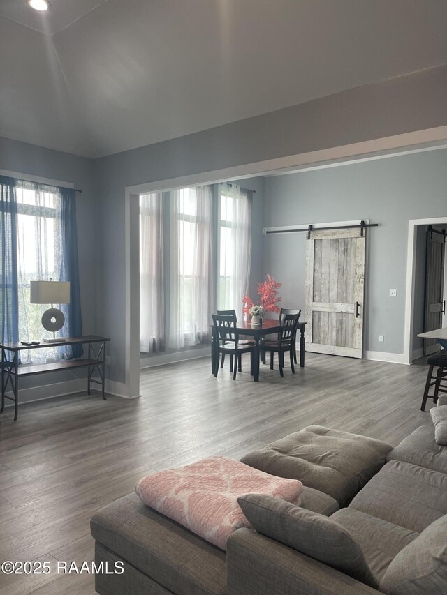 5087 Natali Rd, Lake Charles, LA 70607 - living room with plenty of natural light, baseboards, wood finished floors, and vaulted ceiling