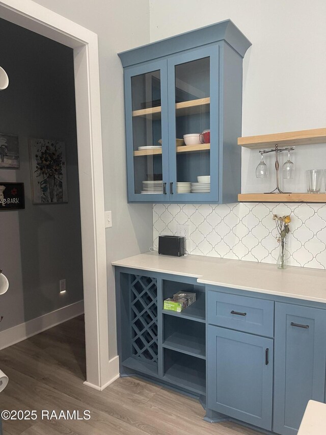 5087 Natali Rd, Lake Charles, LA 70607 - bar with wood finished floors, backsplash, and baseboards