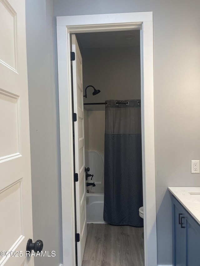 5087 Natali Rd, Lake Charles, LA 70607 - bathroom featuring wood finished floors, vanity, shower / bath combination with curtain, and toilet