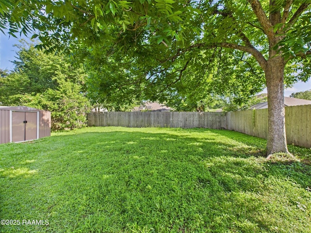 106 Cheticamp Dr, Lafayette, LA 70508 - fenced backyard featuring a storage shed