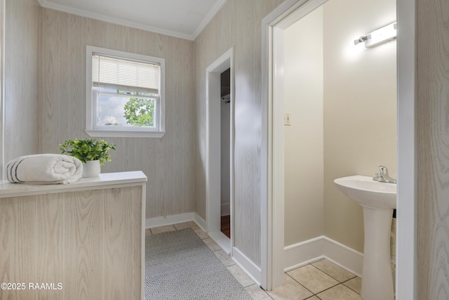 108 Trotter St, New Iberia, LA 70563 - bathroom with ornamental molding, tile patterned floors, baseboards, wallpapered walls, and a sink