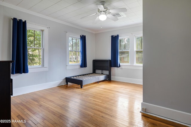 108 Trotter St, New Iberia, LA 70563 - unfurnished bedroom with ornamental molding, hardwood / wood-style floors, baseboards, and ceiling fan
