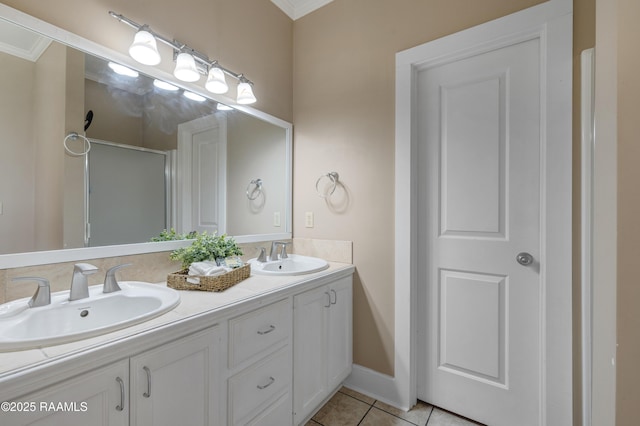 108 Trotter St, New Iberia, LA 70563 - full bath featuring double vanity, tile patterned floors, ornamental molding, and a shower with door