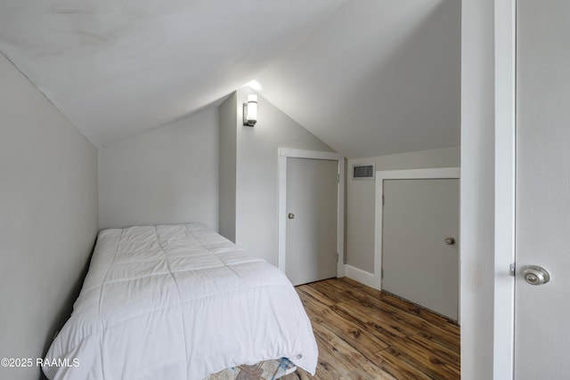 108 Trotter St, New Iberia, LA 70563 - bedroom featuring wood finished floors and vaulted ceiling
