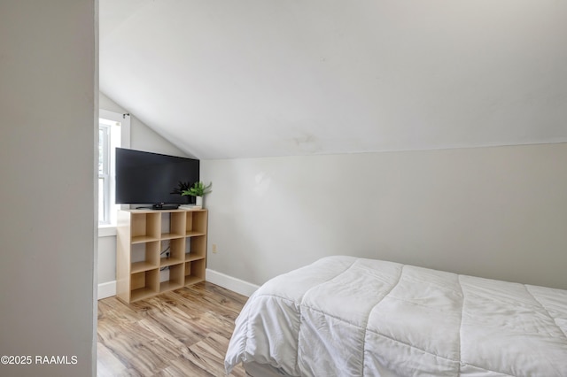 108 Trotter St, New Iberia, LA 70563 - bedroom featuring lofted ceiling, wood finished floors, and baseboards