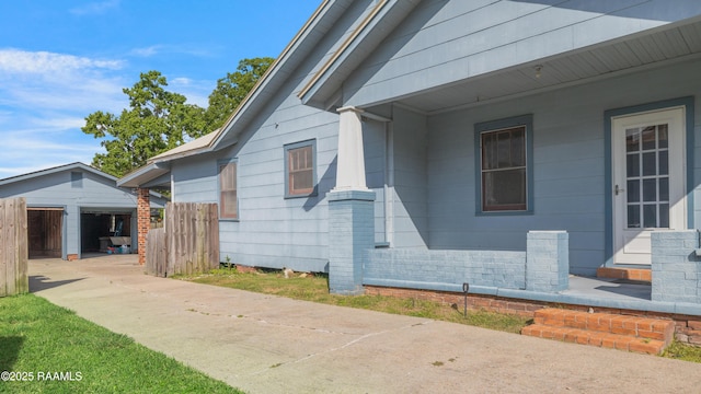 108 Trotter St, New Iberia, LA 70563 - view of home's exterior featuring an outdoor structure and driveway