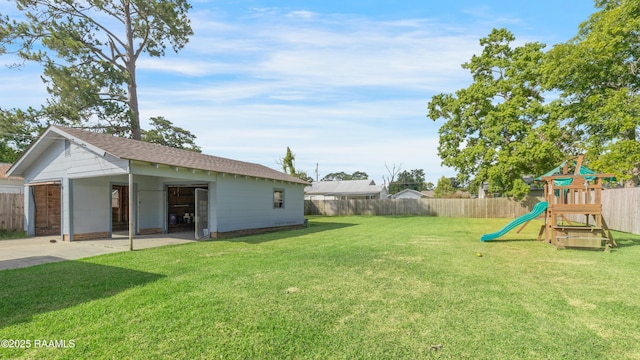 108 Trotter St, New Iberia, LA 70563 - view of yard with a playground, concrete driveway, an outdoor structure, and an attached carport